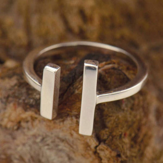 Sterling silver adjustable parallel bar ring, minimalist modern design.