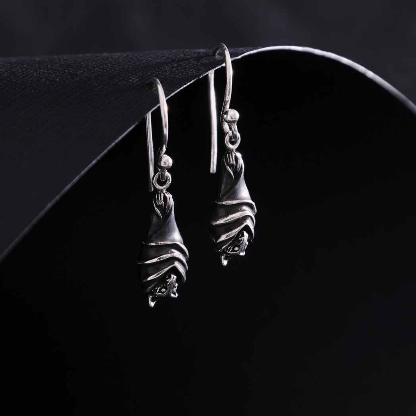 Sterling silver bat dangle earrings, ribbed wings, gothic jewelry, Halloween accessory.

