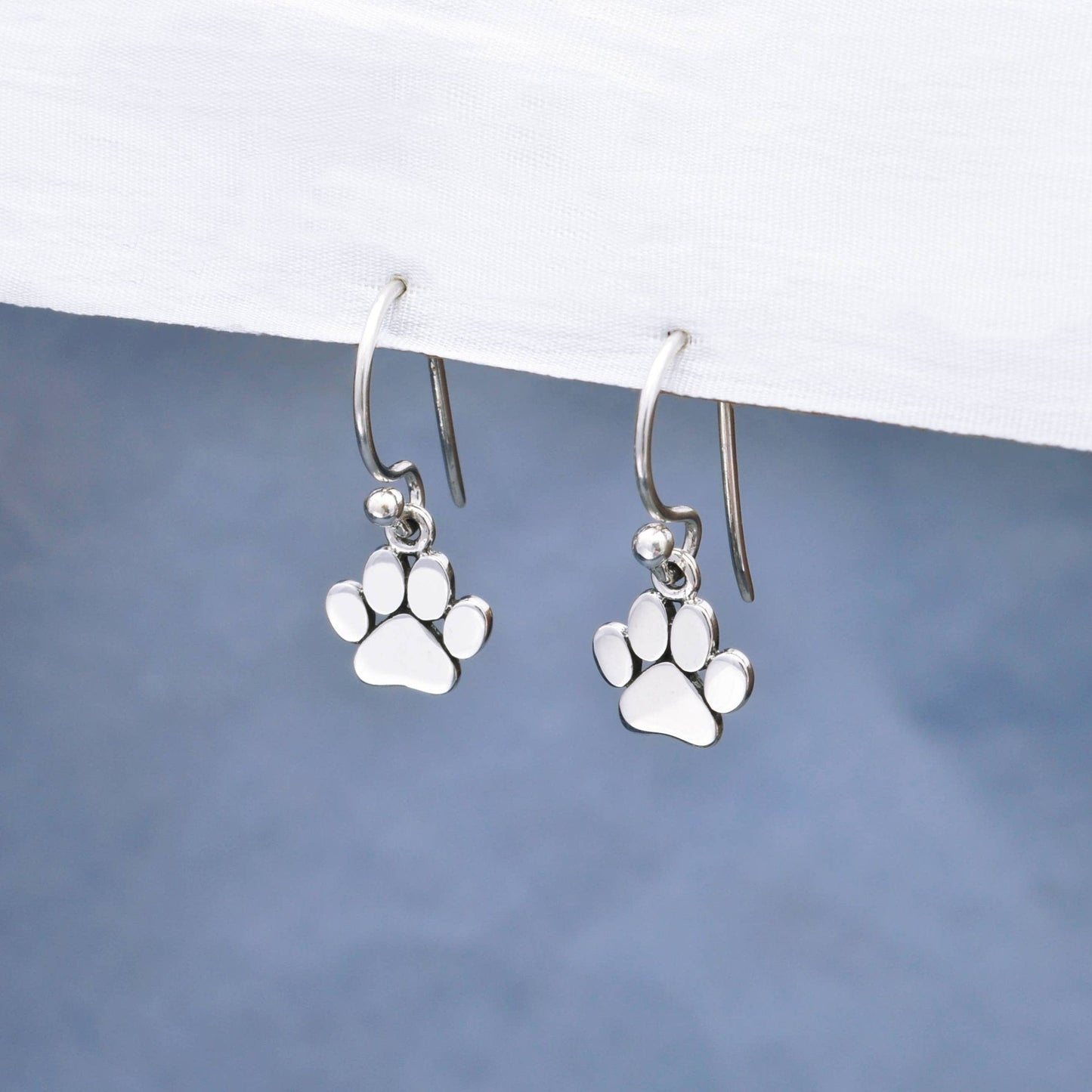 Sterling Silver bold paw design dangle earrings